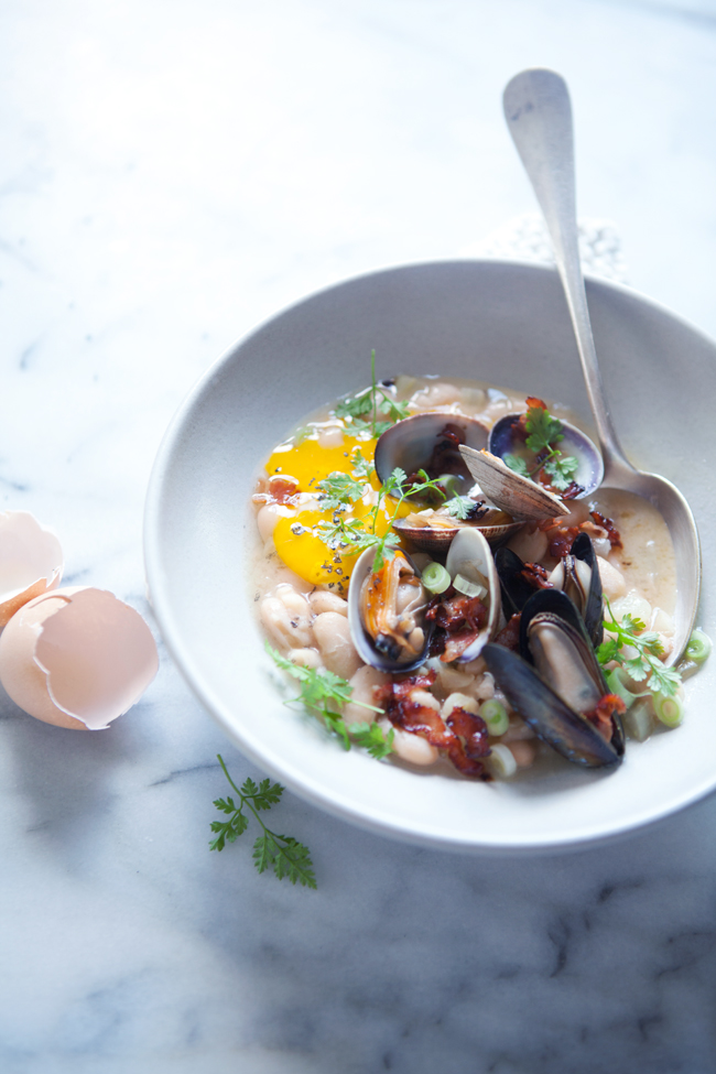 Cannellini stew with fennel, clams, mussels and raw yolk